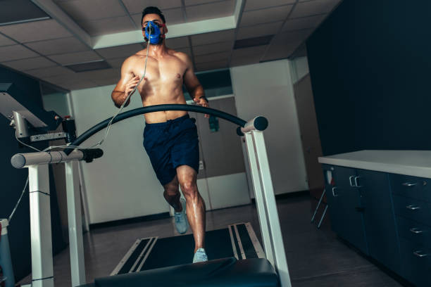 Endurance athlete on a sports science lab treadmill with metabolic testing equipment
